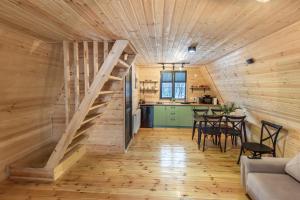 a room with a staircase in a tiny house at Savalley Kazbegi in Kazbegi
