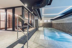a swimming pool in a house at Hotel Diamant Park in Campitello di Fassa