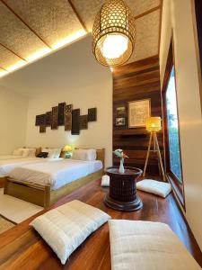 Кровать или кровати в номере Tai Resort