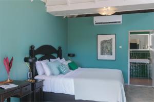 Łóżko lub łóżka w pokoju w obiekcie Kura Botanica Hotel
