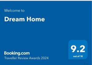 Et logo, certifikat, skilt eller en pris der bliver vist frem på Dream Home
