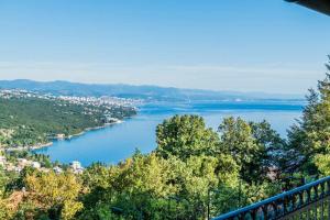 a view of a river from a balcony at Villa Izzi Opatija in Opatija