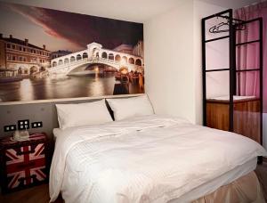 A bed or beds in a room at Good Time Boutique Hotel