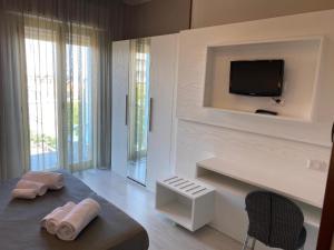 TV a/nebo společenská místnost v ubytování Hotel Biancamano