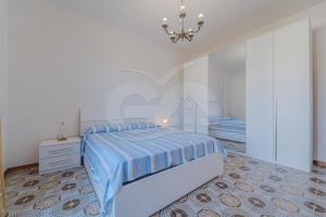A bed or beds in a room at Il Gabbiano Nuovo a Marina di Campo - Goelba