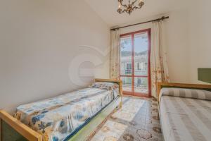 A bed or beds in a room at Il Gabbiano Nuovo a Marina di Campo - Goelba