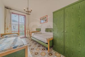 A bed or beds in a room at Il Gabbiano Nuovo a Marina di Campo - Goelba