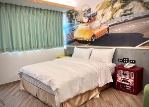 A bed or beds in a room at Good Time Boutique Hotel