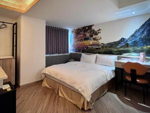 A bed or beds in a room at Good Time Boutique Hotel