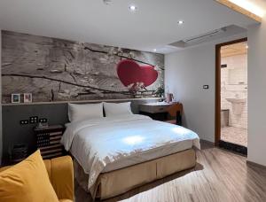 A bed or beds in a room at Good Time Boutique Hotel
