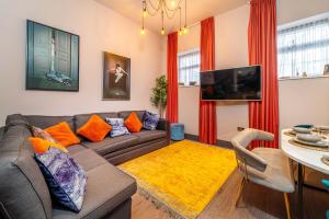 a living room with a couch and a table at Duke Street Townhouse in Liverpool