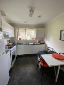 a small kitchen with a table and a table sidx sidx sidx at Self contained 2 bedroom unit in Williamstown