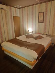 Postel nebo postele na pokoji v ubytování Hotel Fantacy (Adult Only)