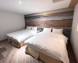 A bed or beds in a room at Good Time Boutique Hotel
