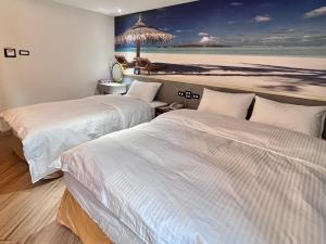 A bed or beds in a room at Good Time Boutique Hotel