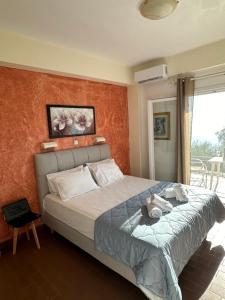 Postel nebo postele na pokoji v ubytování Vladimiros Apartments