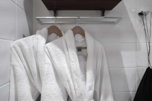 a bathroom with white towels on a rack at Best Western Plus Park City Solna in Solna