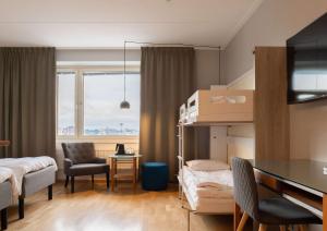 a small room with two beds and a desk at Best Western Plus Park City Solna in Solna +37 photos
