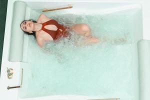 a baby in a bathtub with a doll in it at Kreart Suite & Rooms B&B in Crotone