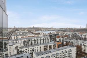 a view of a city with buildings and a river at Best Western Plus Park City Hammarby Sjöstad in Stockholm