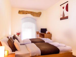 Postel nebo postele na pokoji v ubytování Hotel STARÝ PIVOVAR