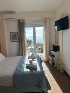 Postel nebo postele na pokoji v ubytování Vladimiros Apartments