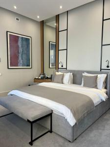 מיטה או מיטות בחדר ב-NEOS HOTEL