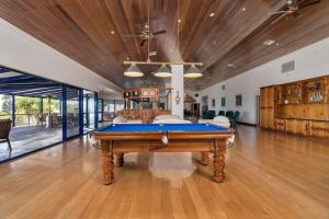 a pool table in the middle of a room at Doyles on the Bay in Kingscote