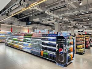 a store aisle of a grocery store with a lot of products at New Modern Luxury Suite Apartment At The Heart of Vientiane in Vientiane