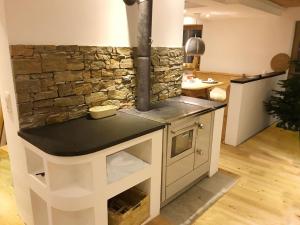 Kuchyň nebo kuchyňský kout v ubytování Almchalet Zillertal