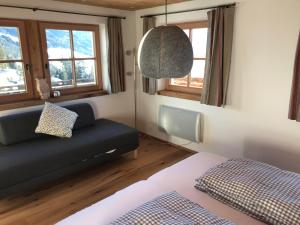 Postel nebo postele na pokoji v ubytování Almchalet Zillertal