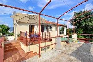 a villa with a view of a house at Apartment Bujas in Šilo