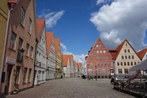 an empty street in a town with buildings at Tiny Home in a Tiny Town in Hjärup