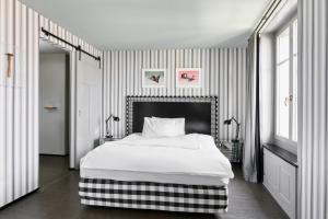 Ένα ή περισσότερα κρεβάτια σε δωμάτιο στο Boutique & Art Hotel Helvetia