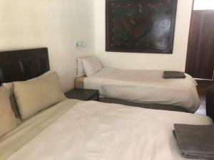 Postel nebo postele na pokoji v ubytování Waverley Guest House
