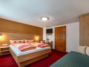 Posteľ alebo postele v izbe v ubytovaní Apartment Grissemann by Interhome