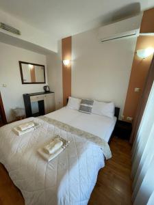 Postel nebo postele na pokoji v ubytování The Bulevard Hotel