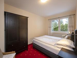 A bed or beds in a room at Holiday Home Steindlwald by Interhome