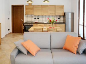 a living room with a couch and a kitchen at Apartment Acero - SBO104 by Interhome in Savona