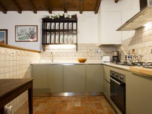 a kitchen with a sink and a stove at Holiday Home Le Bore - CNG122 by Interhome in Sassi