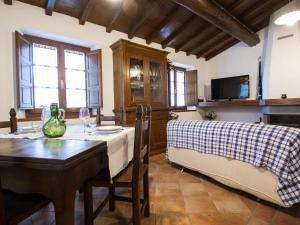 A television and/or entertainment centre at Holiday Home Le Bore - CNG122 by Interhome