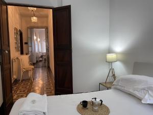 een slaapkamer met een wit bed en een hal bij Apartment Tristano - FLG214 by Interhome in Finale Ligure