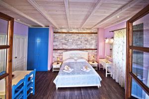 Postel nebo postele na pokoji v ubytování Flamingo Hotel Pelion - Seaside Superior Studios & Suites
