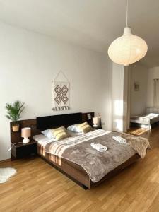 a bedroom with a large bed in a room at Apartment Olivia - Old Town, AC in Bratislava