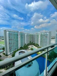 a view of a large apartment building from a balcony at The Bahamas & Maldives Suites at Azure Residences near Manila Airport in Manila