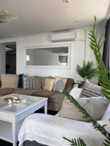 a living room with a couch and a table at Serenity by levante beach (YAGO), 7pax wi-fi A\C in Benidorm