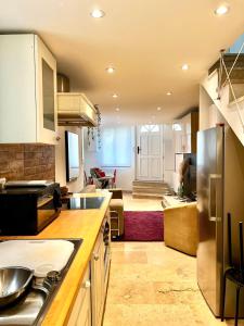a kitchen and living room with a counter top at Town house in Cannes city center in Cannes