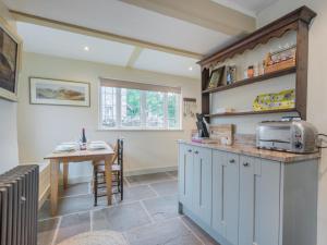 a kitchen with a counter and a table in a room at 2 Bed in Ravenstonedale SZ141 in Ravenstonedale