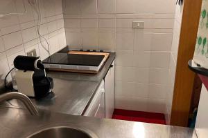 a kitchen with a sink and a counter top at Casa a Cervinia sulle piste in Breuil-Cervinia