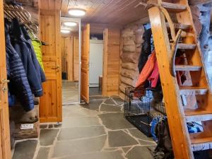 a walk in closet in a log cabin at Holiday Home Sallanhelmi b1 by Interhome in Salla